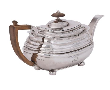 A GEORGE III SILVER OBLONG BALUSTER TEAPOT MAKER'S MARK TH, LONDON 1815 With a wood oblong finial and harp handle, a moulded 