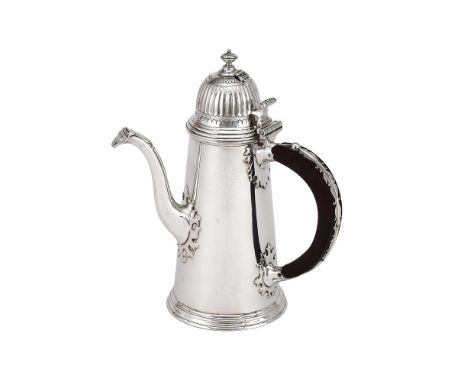 
	
		A SILVER TAPERING CHOCOLATE POT
		WILLIAM COMYNS &amp; SONS LTD., LONDON 1951
		With a compressed finial to the fluted d