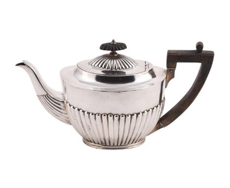 
	
		A VICTORIAN SILVER OVAL HALF LOBED TEA POT
		CHARLES STUART HARRIS, LONDON 1892
		With a wooden lobed oval finial and an