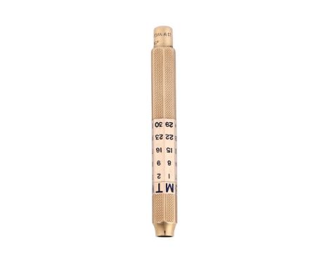 
	
		A GOLD COLOURED AND ENAMEL PROPELLING PENCIL WITH CALENDAR
		S. MORDAN &amp; CO., STAMPED 9CT
		With engine turned decor