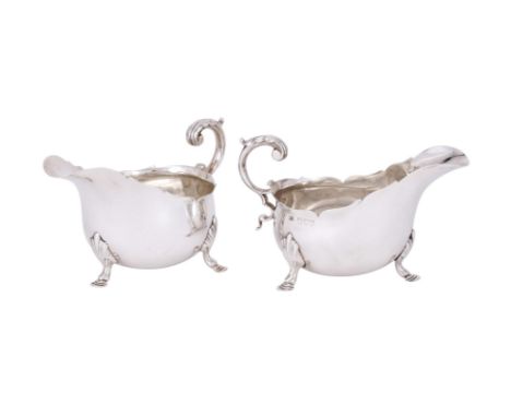 
	
		A PAIR OF VICTORIAN SILVER SHAPED OVAL SAUCE BOATS
		HENRY STRATFORD, LONDON 1895 AND 1896
		With leaf capped flying scr