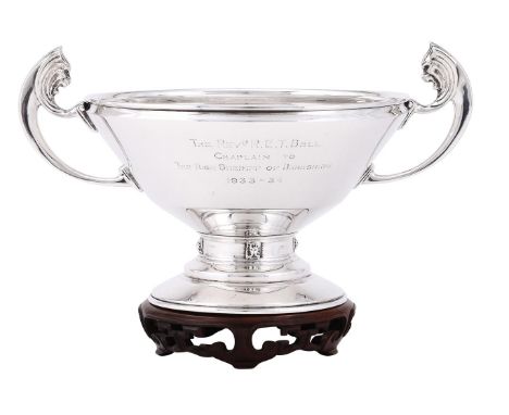
	
		A SILVER TWIN HANDLED TROPHY
		GOLDSMITHS &amp; SILVERSMITHS CO. LTD., LONDON 1934
		With twin lion mask capped loop han