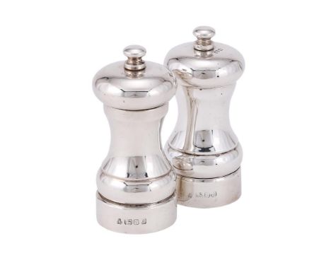 
	
		A PAIR OF SILVER PEPPER MILL GRINDERS
		M. C. HERSEY &amp; SON LTD., LONDON 1990
		With bun finials to the domed covers 