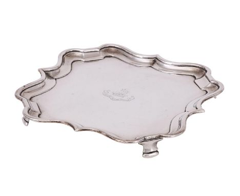 
	
		AN EDWARDIAN SILVER SHAPED SQUARE SALVER
		CHARLES STUART HARRIS, LONDON 1904
		With a raised moulded border, engraved w