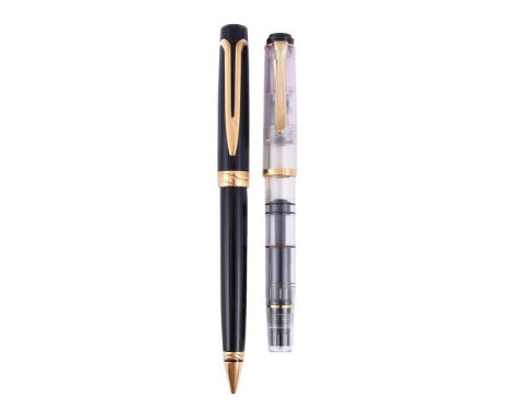 
	
		PELIKAN 
		A CLEAR DEMONSTRATER FOUNTAIN PEN 
		Cap and Barrel: The clear resin cap and barrel, with gilt clip and bands