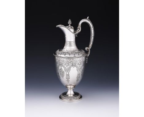 
	
		Y&nbspA VICTORIAN SILVER EWER
		MARTIN, HALL &amp; CO., LONDON 1890
		With a cone finial to the cover, a leaf capped loo