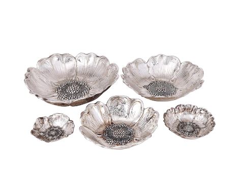
	
		A SET OF THREE SILVER COLOURED FLOWER SHAPED BOWLS
		K. INCE, .900 STANDARD
		The smallest 27cm (10 1/2in) diameter and 