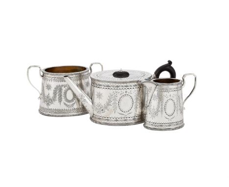 
	
		A VICTORIAN MATCHED SILVER OVAL THREE PIECE TEA SET
		THE TEA POT AND CREAM JUG BY HENRY HOLLAND, LONDON 1864, THE SUGAR
