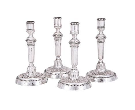 
	
		A SET OF FOUR CONTINENTAL SILVER CANDLESTICKS
		PROBABLY GERMAN, LIEGNITZ LATE 17TH CENTURY
		With beaded capitals, flut