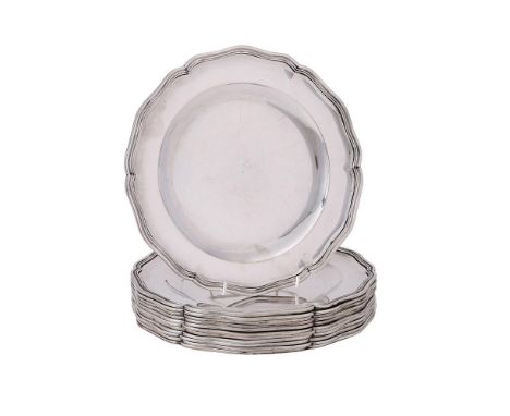 
	
		A SET OF TWELVE POLISH SILVER SHAPED CIRCULAR PLATES
		WARSAW, 1920 - 1963 .800 STANDARD
		With a raised moulded border
