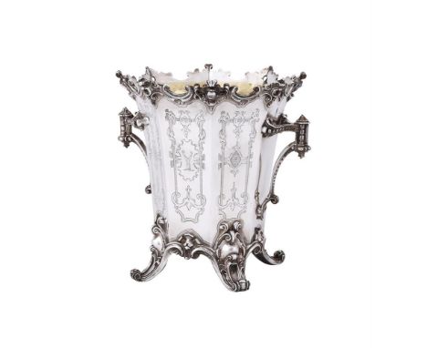 
	
		AN ELECTRO-PLATED OCTAGONAL WINE COOLER
		ELKINGTON &amp; CO.
		With a C-scroll chased shaped border, twin scrolled hand