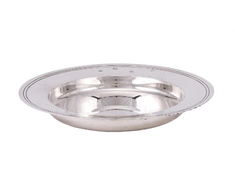 
	
		A SILVER ARMADA DISH
		WILLIAM COMYNS &amp; SONS LTD., LONDON 1972
		With a reeded border
		22.5cm (8 3/4in) diameter
		