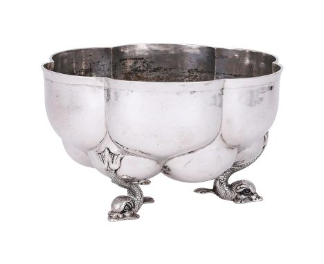 
	
		A GERMAN SILVER SHAPED CIRCULAR BOWL
		LUDWIG NERESHEIMER, HANAU, POST 1886 .800 STANDARD
		On three dolphin feet
		28cm