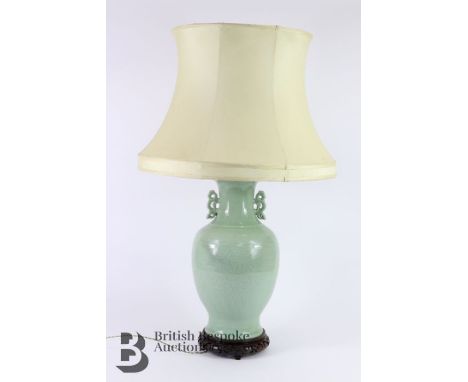 Chinese celadon lamp base, 19th century, with incised floral decoration and pierced chimera handles, drilled, approx 39 cms h