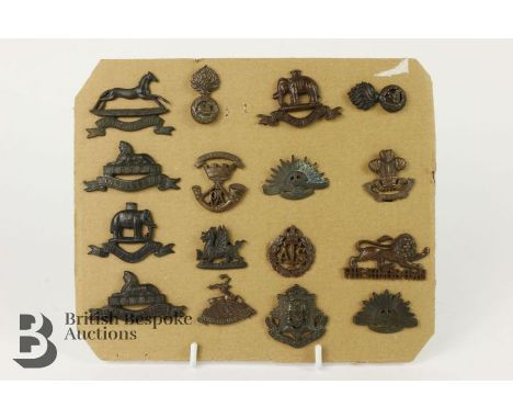 Display of fifteen British Army Officer's Army Service Dress badges A.T.S Lincolns, Welsh, West Yorkshire, East Surrey etc.&n