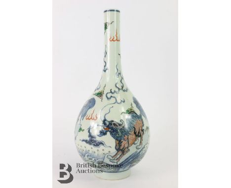 Chinese porcelain bottle vase, decorated with dragons and cloud scrolls, Kangxi marks to base, measures approx. 29cms h.&nbsp