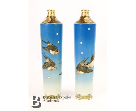 Satsuma tapering vases painted a graduated blue enamel with sparrow in flight amongst falling magnolia petals, poly-chrome en