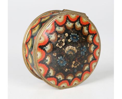 An early 19th century French lacquered papier-mâché cylindrical snuff box, the hinged lid painted with flowers, the sides and