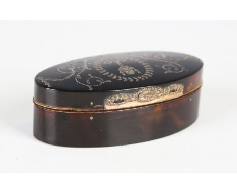 A George III tortoiseshell and gilt metal mounted navette-shaped snuff box, the hinged lid piqué inlaid with a foliate pendan