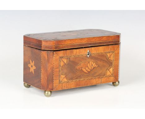 A George III mahogany canted rectangular tea caddy, the hinged lid and sides crossbanded in kingwood within bands of boxwood 