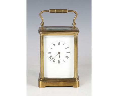 An early 20th century French brass cased carriage timepiece with eight day movement and white enamel dial, height 13.5cm, wid