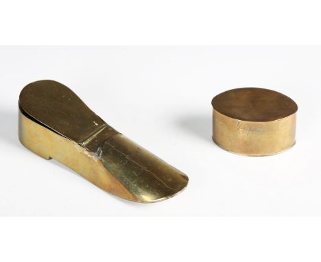 A 19th century brass snuff box of shoe form, engraved with a figure and inscribed 'The Cook L. Birch London', length 14cm, to