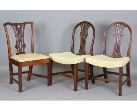 A pair of George III mahogany arched back dining chairs with pierced splats and shaped seats, height 96cm, width 56cm, togeth