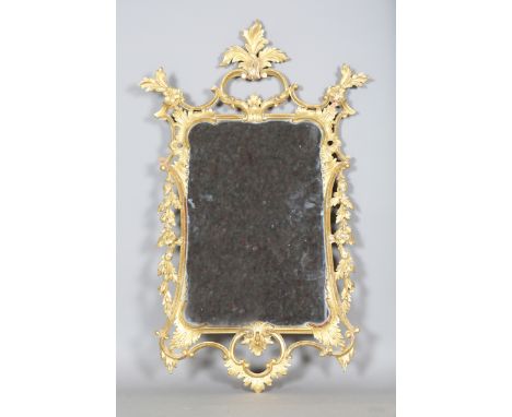 A 20th century George III style carved giltwood and gesso wall mirror, the rococo style frame modelled with acanthus leaves a
