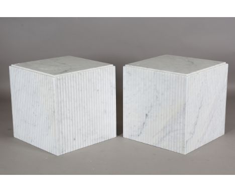 A pair of modern Italian white marble pedestal lamp tables with fluted side panels, height 51cm, width 50.5cm.Buyer’s Premium