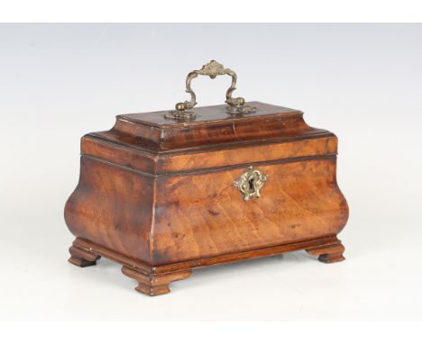 An early George III figured mahogany tea caddy of bombé form, the pagoda moulded lid with a gilt brass foliate handle, raised