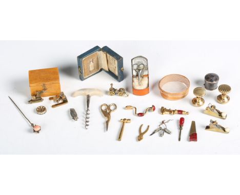 A group of mainly 19th century miniature collectors' items, including a selection of gilt brass woodworking tools, a Stevenso