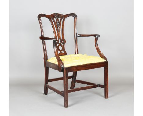 A George III Chippendale period mahogany elbow chair with a finely carved and pierced splat back, height 96cm, width 63cm. Pr