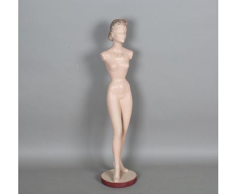 A mid-20th century diminutive composite shop mannequin, inscribed 'Svelta', the circular base detailed 'Hovita', height 105cm