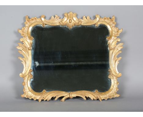 A George III Rococo period giltwood wall mirror, the frame carved with scrolling foliage and 'C' scrolls, 61cm x 74cm (later 