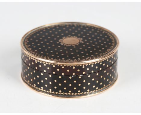 A late 18th/early 19th century tortoiseshell and gold mounted cylindrical snuff box and cover, piqué inlaid with overall gold