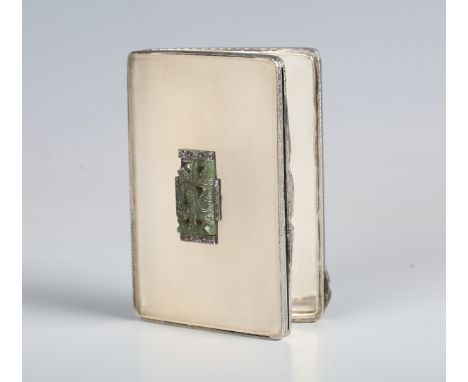 An Art Deco silver and frosted glass compact, import mark for London 1933 by Stockwell &amp; Co, the sides with black enamel,