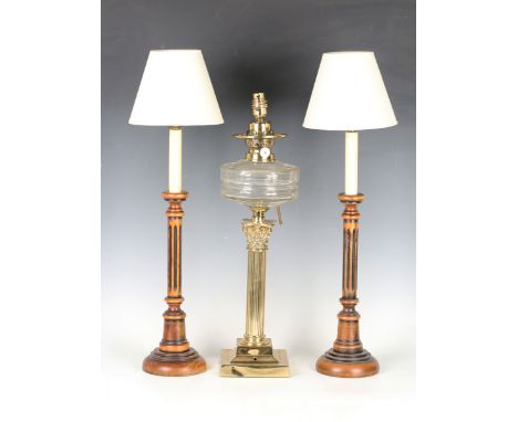 An Edwardian brass and clear cut glass table oil lamp of Corinthian column form, converted to electricity, height 50cm, toget