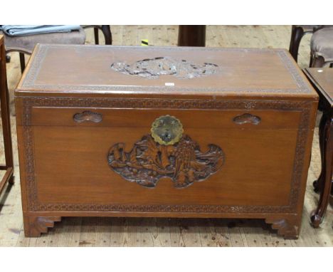 Oriental carved camphorwood trunk, 60cm by 104cm.