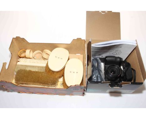 Box of ivory brushes, letter knives, napkin rings and bodkin holder, and Fuji camera.