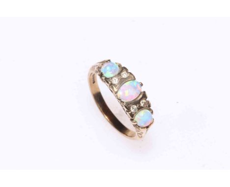 Opal and diamond ring set in 9 carat gold.