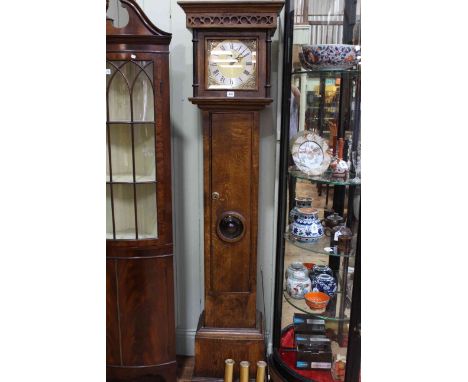 Oak triple weight longcase clock having square brass and silvered dial.