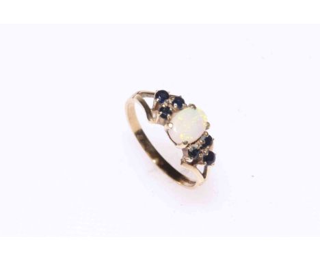 Opal and sapphire ring set in 9 carat gold, size O.