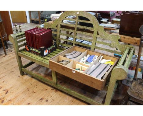Weathered arched back hardwood garden bench, 104cm by 165cm.