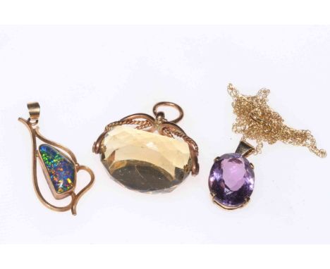 Two gold amethyst and opal pendants and gold mounted citrine swivel fob (3).