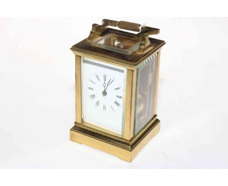 Gilt brass carriage clock with striking movement.