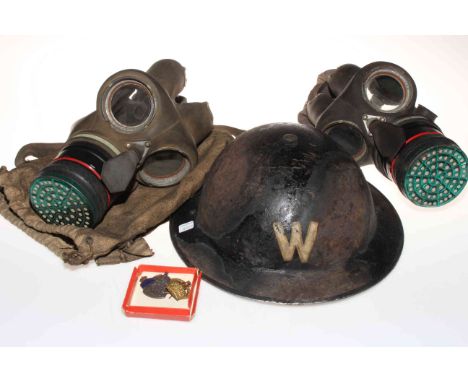 WWII Air Wardens helmet, two gas masks and ARP badges.