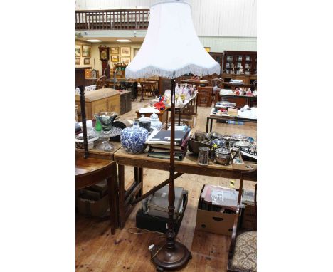 Turned mahogany standard lamp and shade.