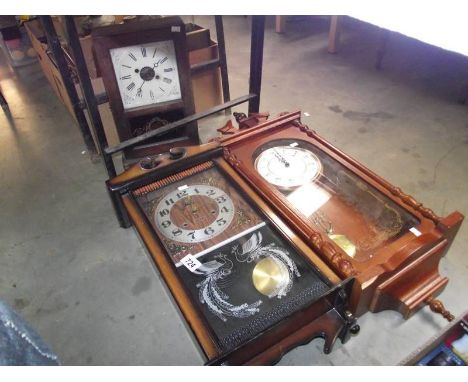 2 wall clocks and a mantel clock