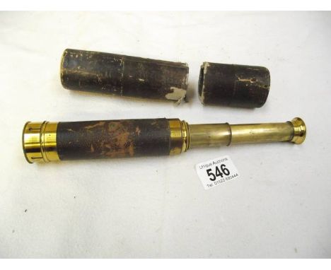 A brass telescope in case, case a/f.