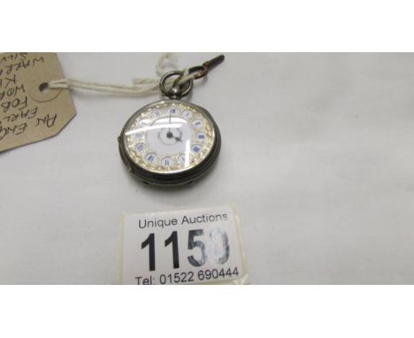 A silver engine turned fob watch, in working order and with key.